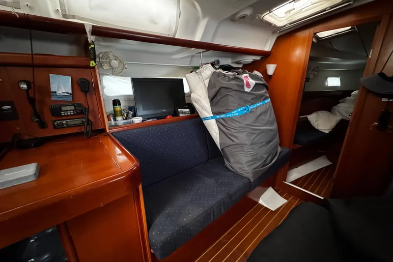 Still In The Moment Yacht Photos Pics Interior of 2007 Beneteau 423 sailboat with seating, navigation equipment, and storage.