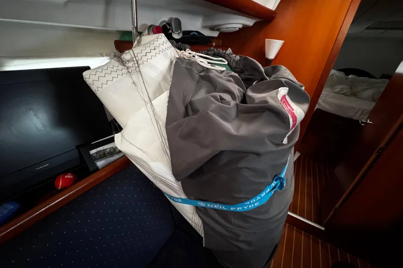 Still In The Moment Yacht Photos Pics Sail storage inside 2007 Beneteau 423 yacht cabin with wooden interior.