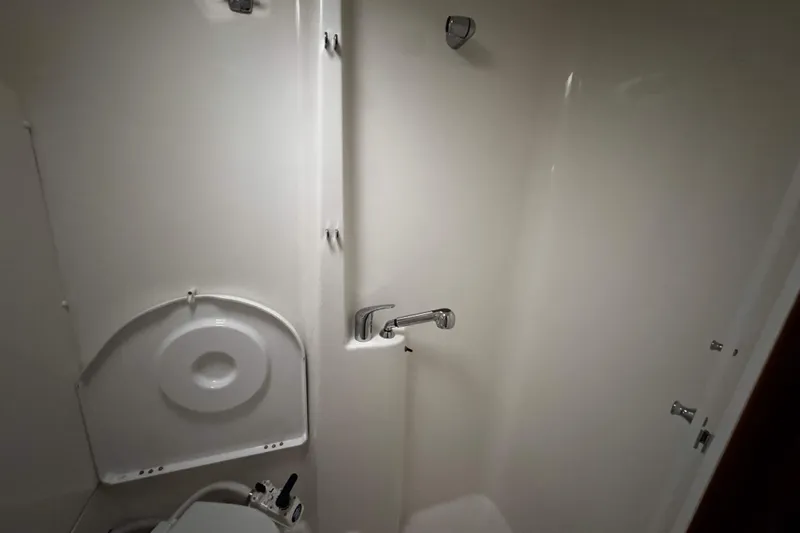 Still In The Moment Yacht Photos Pics Bathroom interior of 2007 Beneteau 423 yacht, featuring shower and toilet.