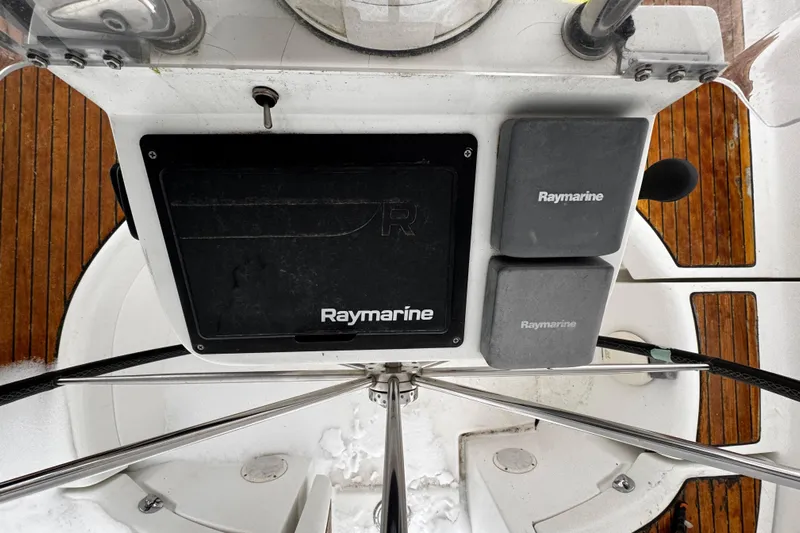 Still In The Moment Yacht Photos Pics Beneteau 423 helm with Raymarine equipment, 2007 model.