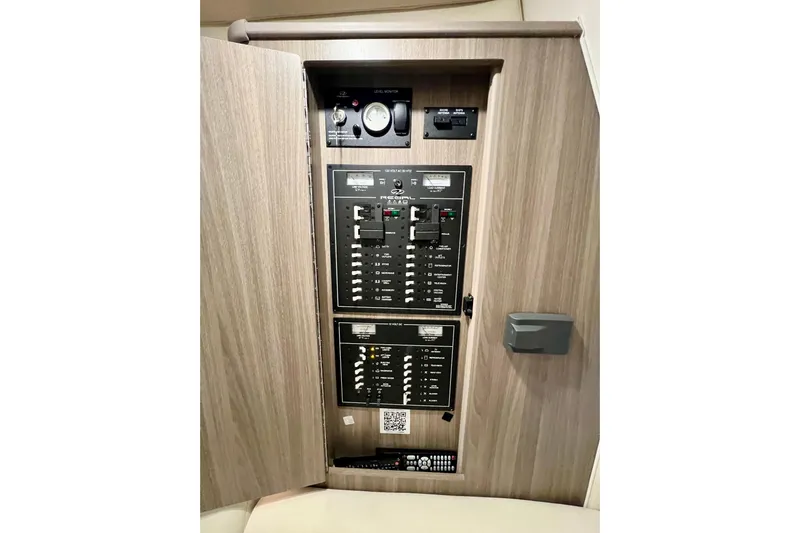 Aventuras Yacht Photos Pics Electrical control panel inside 2021 Regal 33 XO boat, featuring switches and gauges.