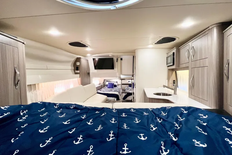 Aventuras Yacht Photos Pics Interior of 2021 Regal 33 XO yacht with modern furnishings and nautical decor.