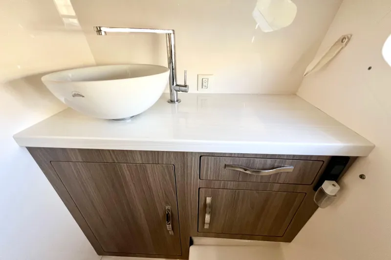 Aventuras Yacht Photos Pics Modern bathroom vanity with vessel sink in 2021 Regal 33 XO boat.