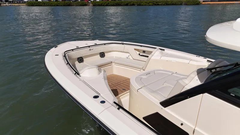  Yacht Photos Pics 2024 Scout 377 LXF boat with spacious seating on calm water.