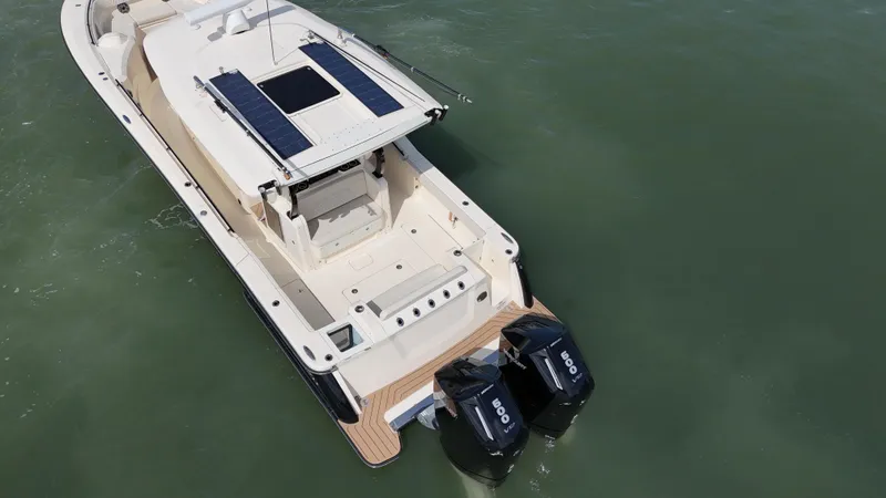  Yacht Photos Pics 2024 Scout 377 LXF boat with dual engines on calm water.