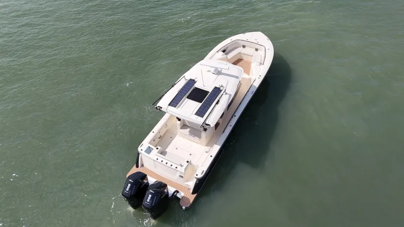  Yacht Photos Pics 2024 Scout 377 LXF boat with dual engines on open water.