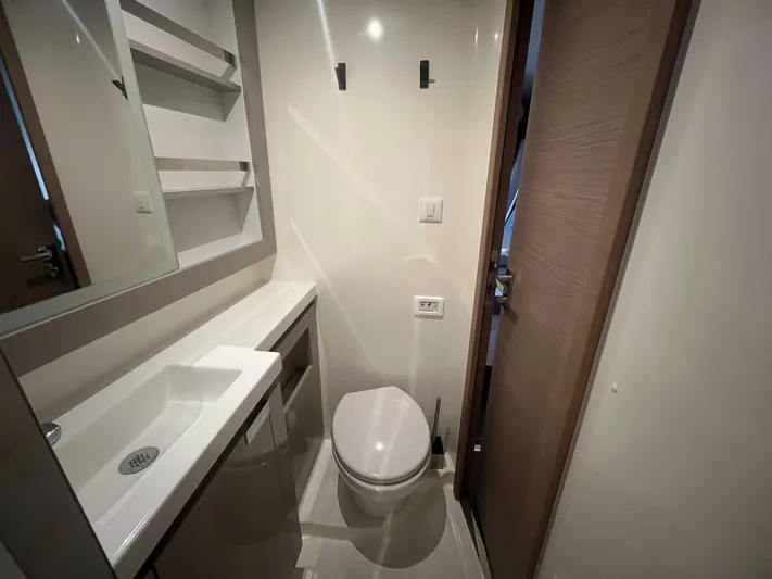  Yacht Photos Pics Modern bathroom in 2022 Fountaine Pajot Elba 45 yacht, featuring sleek design and compact layout.