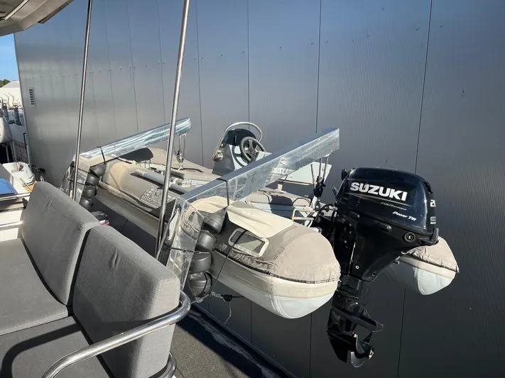  Yacht Photos Pics Dinghy with Suzuki outboard motor on Fountaine Pajot Elba 45 catamaran, 2022 model.