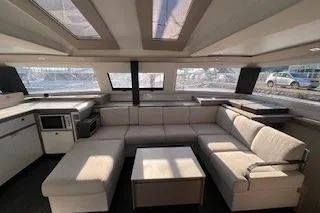  Yacht Photos Pics Interior of 2022 Fountaine Pajot Elba 45 catamaran with modern seating and large windows.