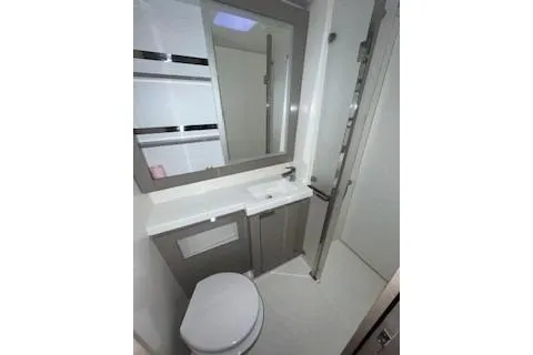  Yacht Photos Pics Modern bathroom in 2022 Fountaine Pajot Elba 45 yacht with sleek design and fixtures.