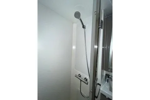  Yacht Photos Pics 2022 Fountaine Pajot Elba 45 yacht shower with modern fixtures and sleek design.