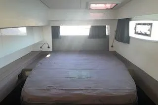  Yacht Photos Pics 2022 Fountaine Pajot Elba 45 cabin interior with bed, windows, and modern design.