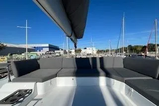  Yacht Photos Pics 2022 Fountaine Pajot Elba 45 catamaran with spacious seating, docked at marina.