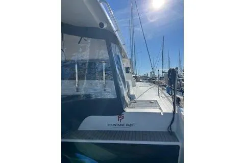  Yacht Photos Pics 2022 Fountaine Pajot Elba 45 catamaran docked under clear blue sky.