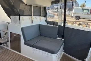  Yacht Photos Pics 2022 Fountaine Pajot Elba 45 yacht interior with cushioned seating and modern design.