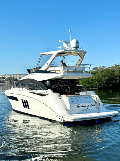 Bateau D’amis Yacht Photos Pics 2016 Sea Ray 510 Fly yacht cruising on a sunny day, showcasing sleek design and luxury.