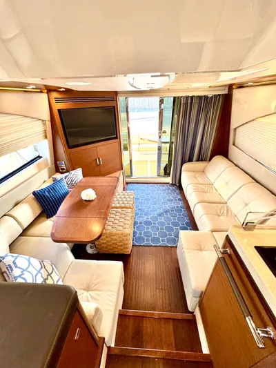 Bateau D’amis Yacht Photos Pics Luxurious interior of 2016 Sea Ray 510 Fly yacht with elegant seating and modern decor.