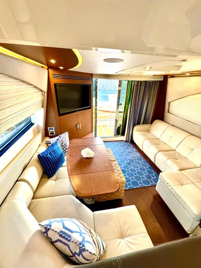 Bateau D’amis Yacht Photos Pics Luxurious interior of 2016 Sea Ray 510 Fly yacht with plush seating and modern decor.