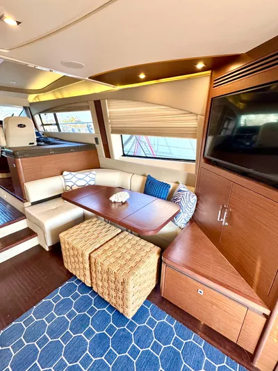 Bateau D’amis Yacht Photos Pics Luxurious interior of 2016 Sea Ray 510 Fly yacht with elegant seating and modern decor.