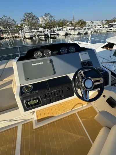 Bateau D’amis Yacht Photos Pics Helm of 2016 Sea Ray 510 Fly yacht with Raymarine navigation system, docked at marina.