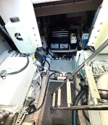 Bateau D’amis Yacht Photos Pics Engine room of 2016 Sea Ray 510 Fly yacht, showcasing mechanical components and equipment.