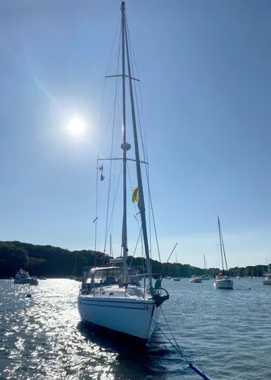  Yacht Photos Pics Sailboat Catalina 42 MkII 2001 on sunny water, with clear sky and distant boats.
