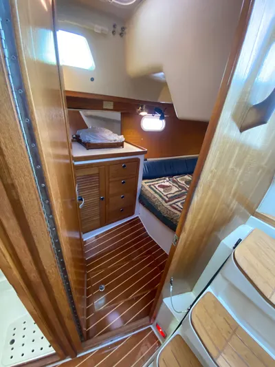  Yacht Photos Pics 2001 Catalina 42 MkII yacht interior with wood finish and cozy cabin.