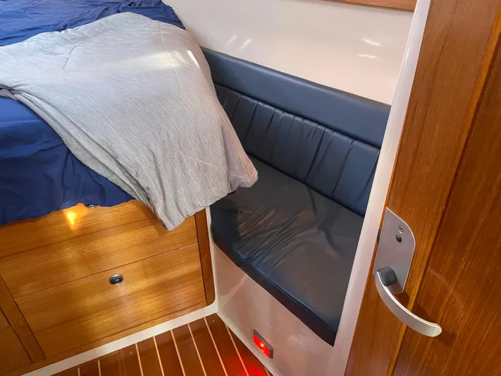  Yacht Photos Pics Interior of a 2001 Catalina 42 MkII yacht with wooden cabinetry and cushioned seating.