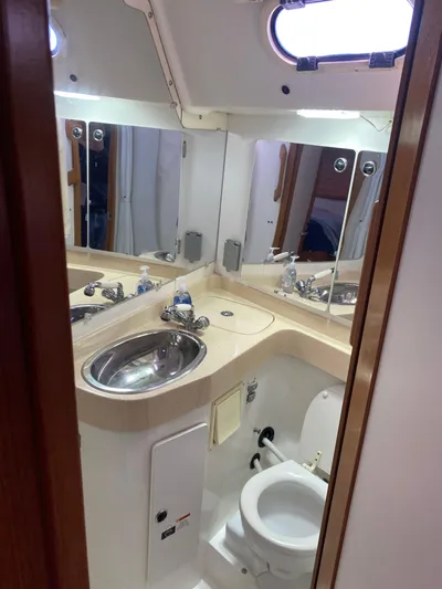  Yacht Photos Pics Bathroom interior of a 2001 Catalina 42 MkII yacht with sink and toilet.