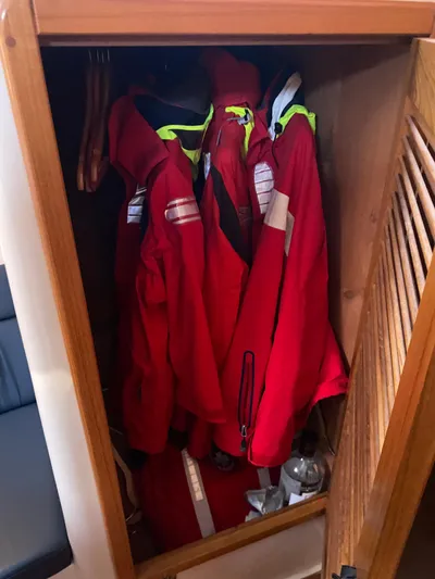  Yacht Photos Pics Red jackets hanging in a wooden closet on a 2001 Catalina 42 MkII sailboat.