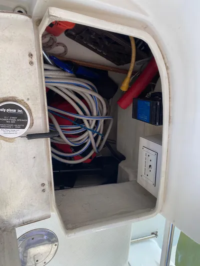  Yacht Photos Pics Storage compartment on a 2001 Catalina 42 MkII sailboat with ropes and electrical outlet.