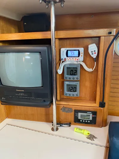  Yacht Photos Pics Control panel and TV inside a 2001 Catalina 42 MkII sailboat cabin.