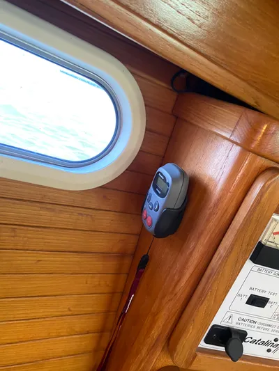  Yacht Photos Pics Interior of 2001 Catalina 42 MkII sailboat with wooden paneling and control device.