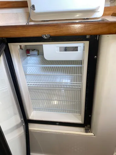  Yacht Photos Pics Empty refrigerator inside a 2001 Catalina 42 MkII sailboat galley.
