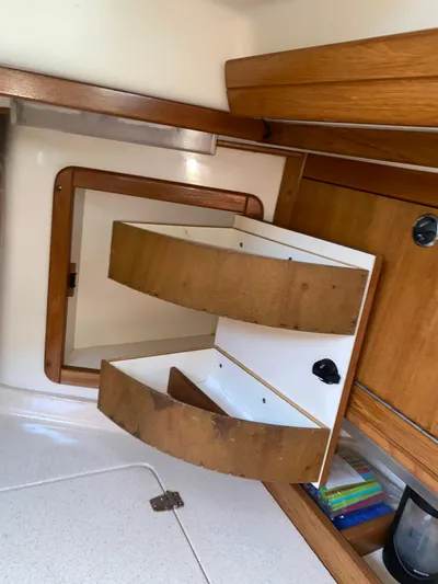  Yacht Photos Pics 2001 Catalina 42 MkII interior with wooden cabinetry and open storage compartments.