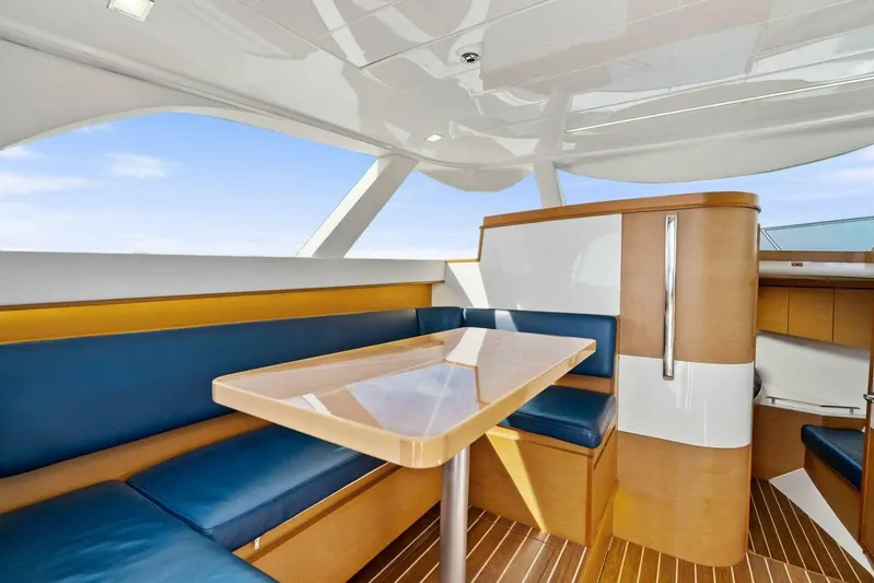 Still Dancing Yacht Photos Pics Interior of 2017 Bertram 35 Flybridge with sleek seating and modern design.