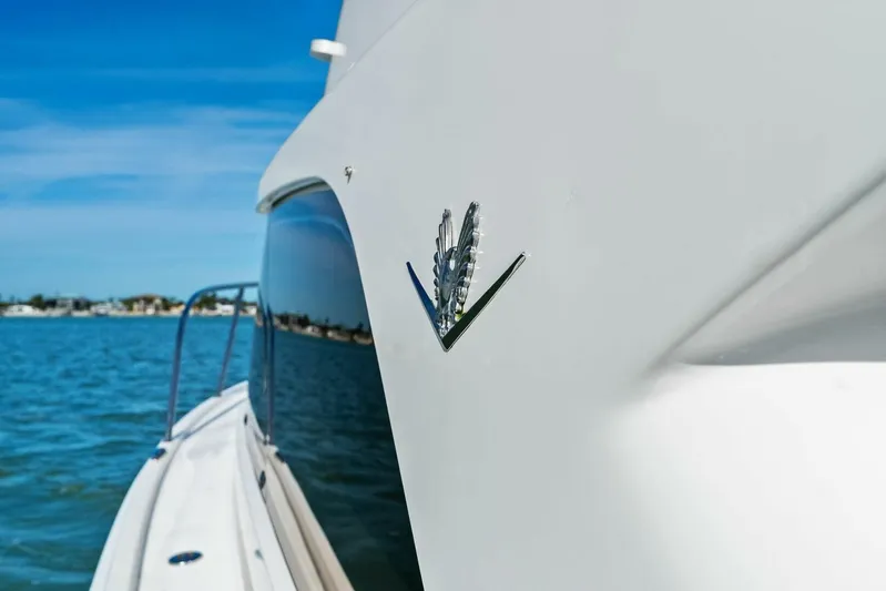 Still Dancing Yacht Photos Pics 2017 Bertram 35 Flybridge yacht on calm blue waters, showcasing sleek design.