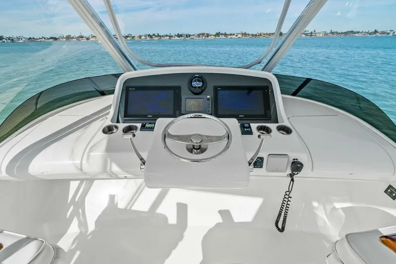 Still Dancing Yacht Photos Pics 2017 Bertram 35 Flybridge helm with dual screens and ocean view.