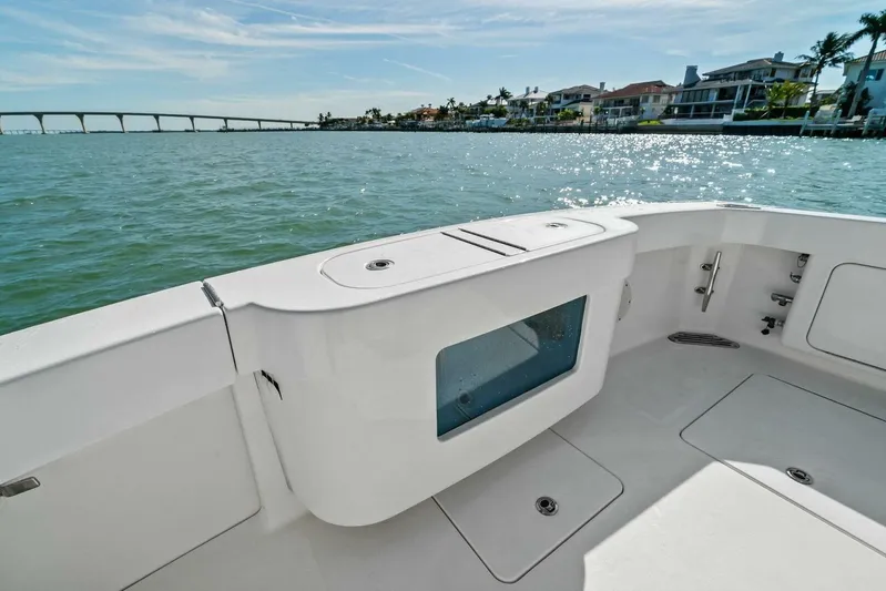 Still Dancing Yacht Photos Pics 2017 Bertram 35 Flybridge boat deck with ocean view and coastal homes.