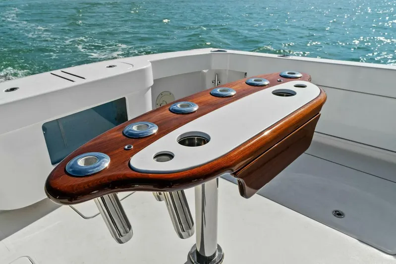 Still Dancing Yacht Photos Pics Bertram 35 Flybridge 2017 yacht cockpit with polished wood and metal rod holders.