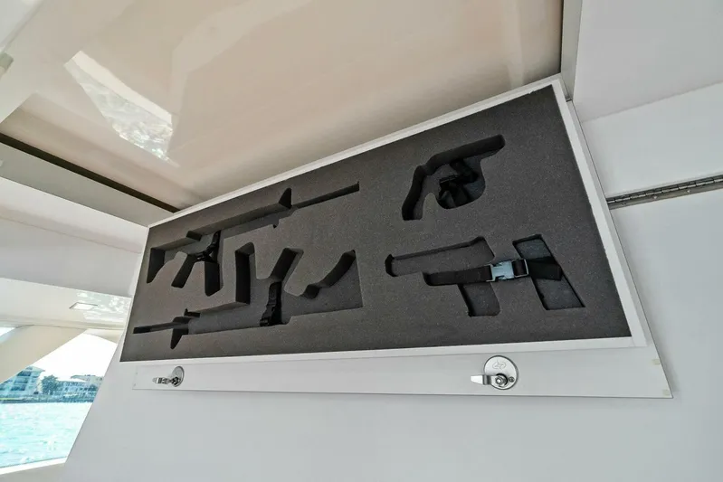 Still Dancing Yacht Photos Pics Hidden gun storage compartment on a 2017 Bertram 35 Flybridge yacht.