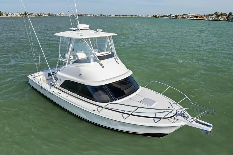 Still Dancing Yacht Photos Pics 2017 Bertram 35 Flybridge yacht cruising on calm waters.