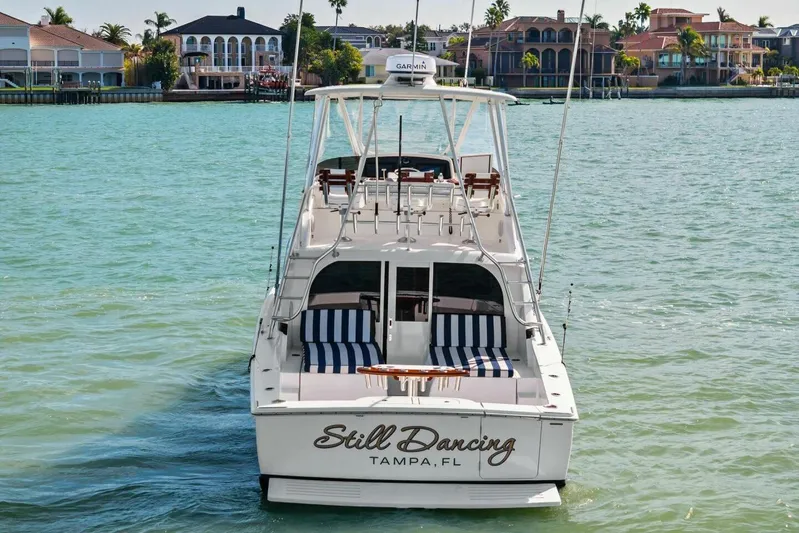 Still Dancing Yacht Photos Pics 2017 Bertram 35 Flybridge yacht on water, rear view, "Still Dancing" in Tampa, FL.