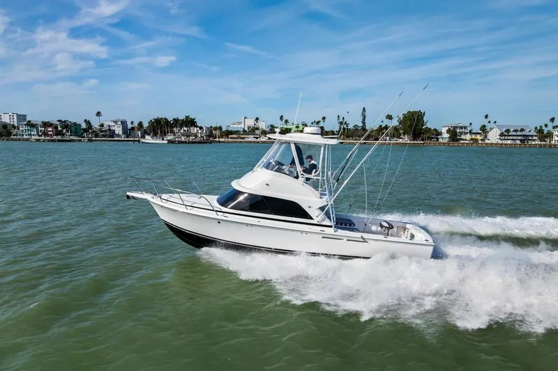 Still Dancing Yacht Photos Pics 2017 Bertram 35 Flybridge cruising on a sunny day in coastal waters.