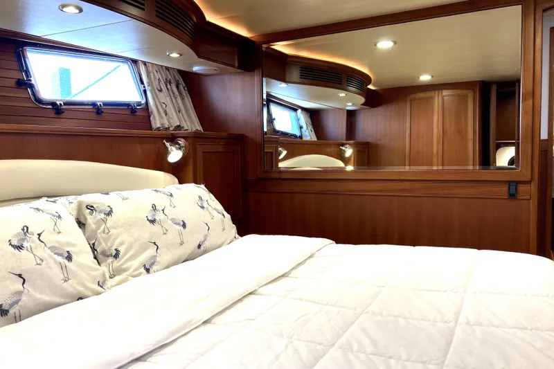 Grace Yacht Photos Pics Luxurious cabin interior of 2019 Marlow 49E yacht with elegant wood finish.