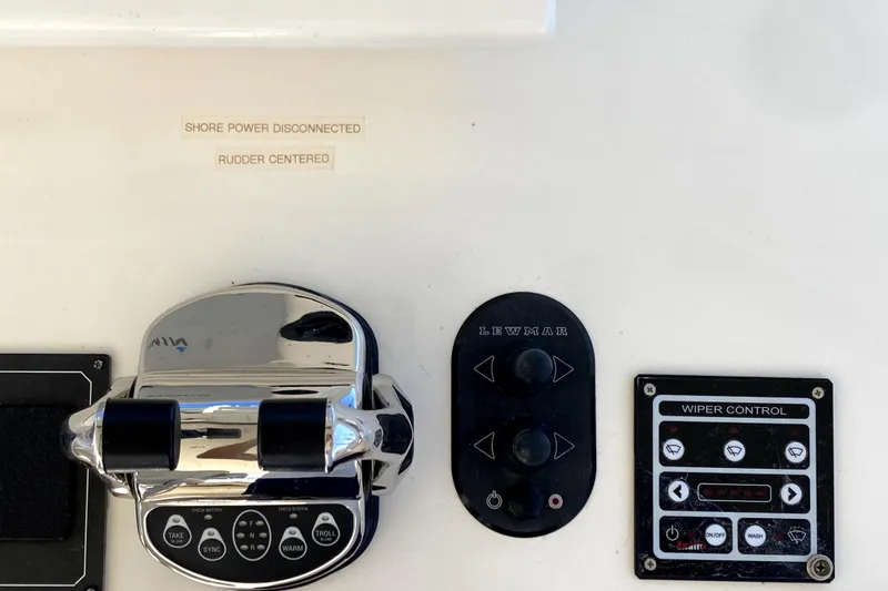 Grace Yacht Photos Pics Control panel of a 2019 Marlow 49E yacht with throttle and wiper controls.