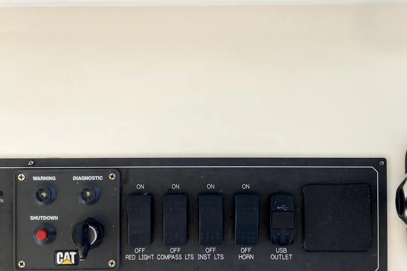 Grace Yacht Photos Pics Control panel of a 2019 Marlow 49E with switches and USB outlet.