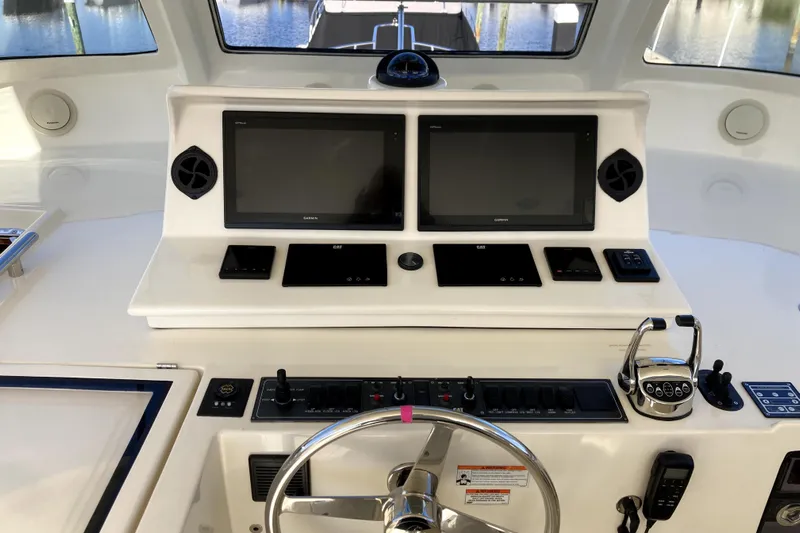 Grace Yacht Photos Pics Helm of 2019 Marlow 49E yacht with dual Garmin displays and control panel.
