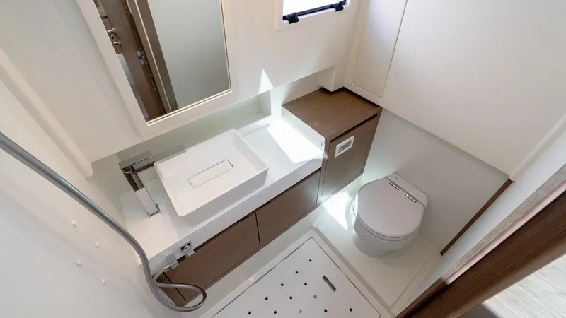  Yacht Photos Pics Modern bathroom interior of 2023 Pardo Yachts P38, featuring sleek sink and toilet design.