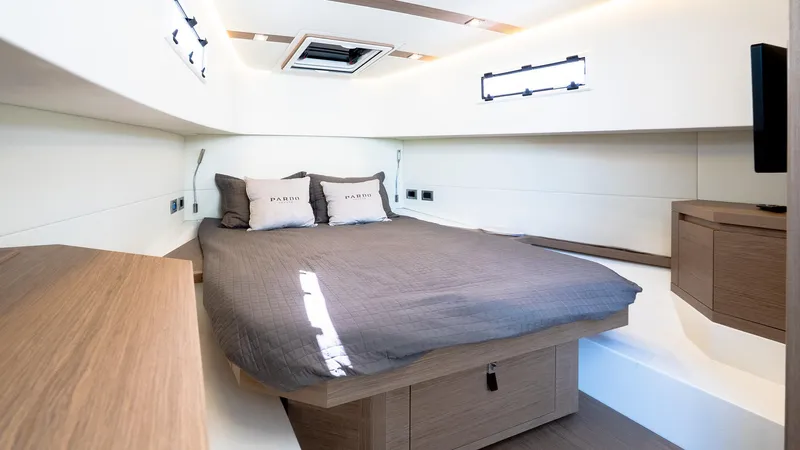  Yacht Photos Pics Luxurious cabin interior of 2023 Pardo Yachts P38, featuring a cozy bed and modern design.